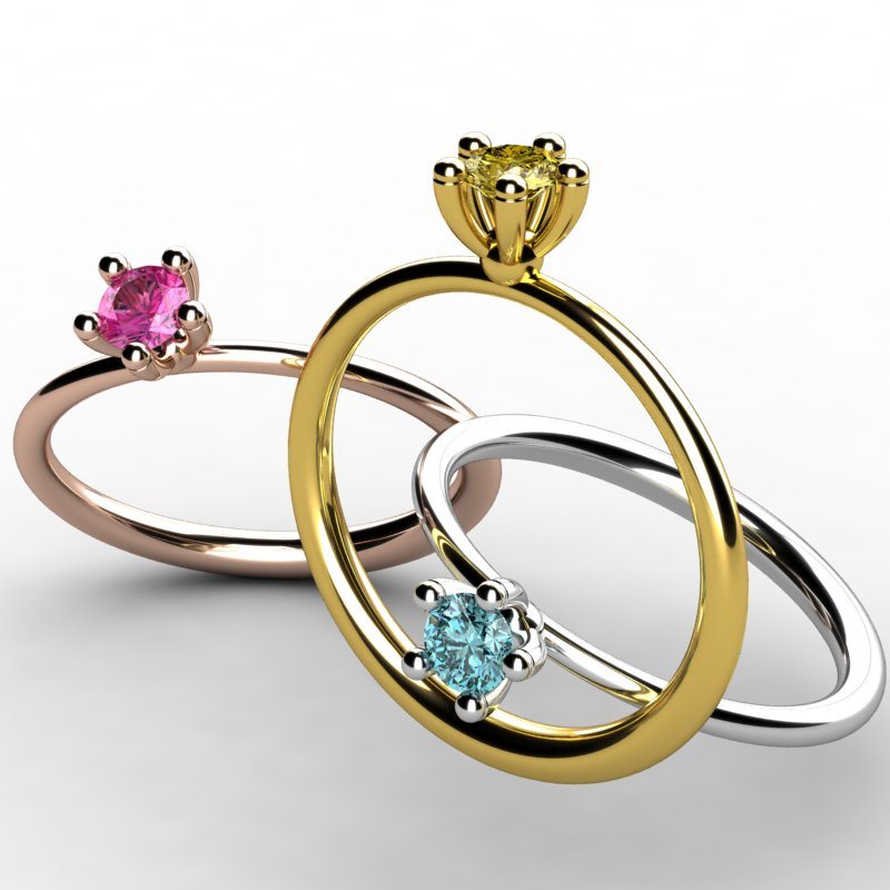 Render de tres solitarios en oro rosa, amarillo y blanco con piedras de color